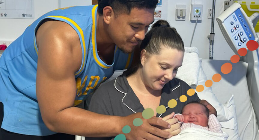 Mother and father holding newborn baby